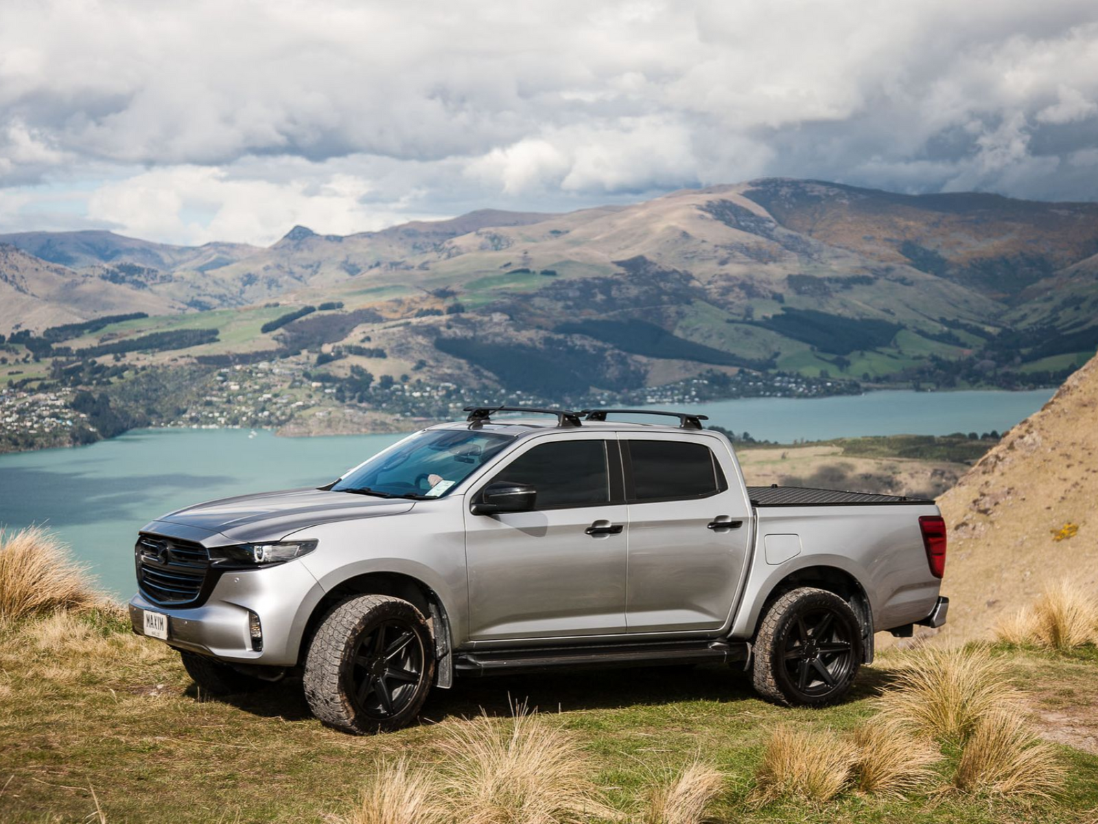 MAZDA BT-50 with MAXIM Hard Lid off road on a mountain