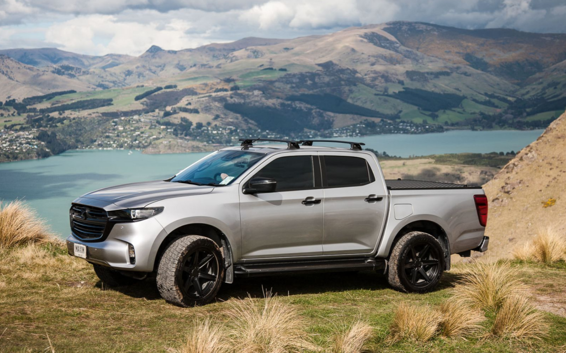 Mazda BT-50 with MAXIM Hard Lid on the Port Hills with the Diamond Harbour view.