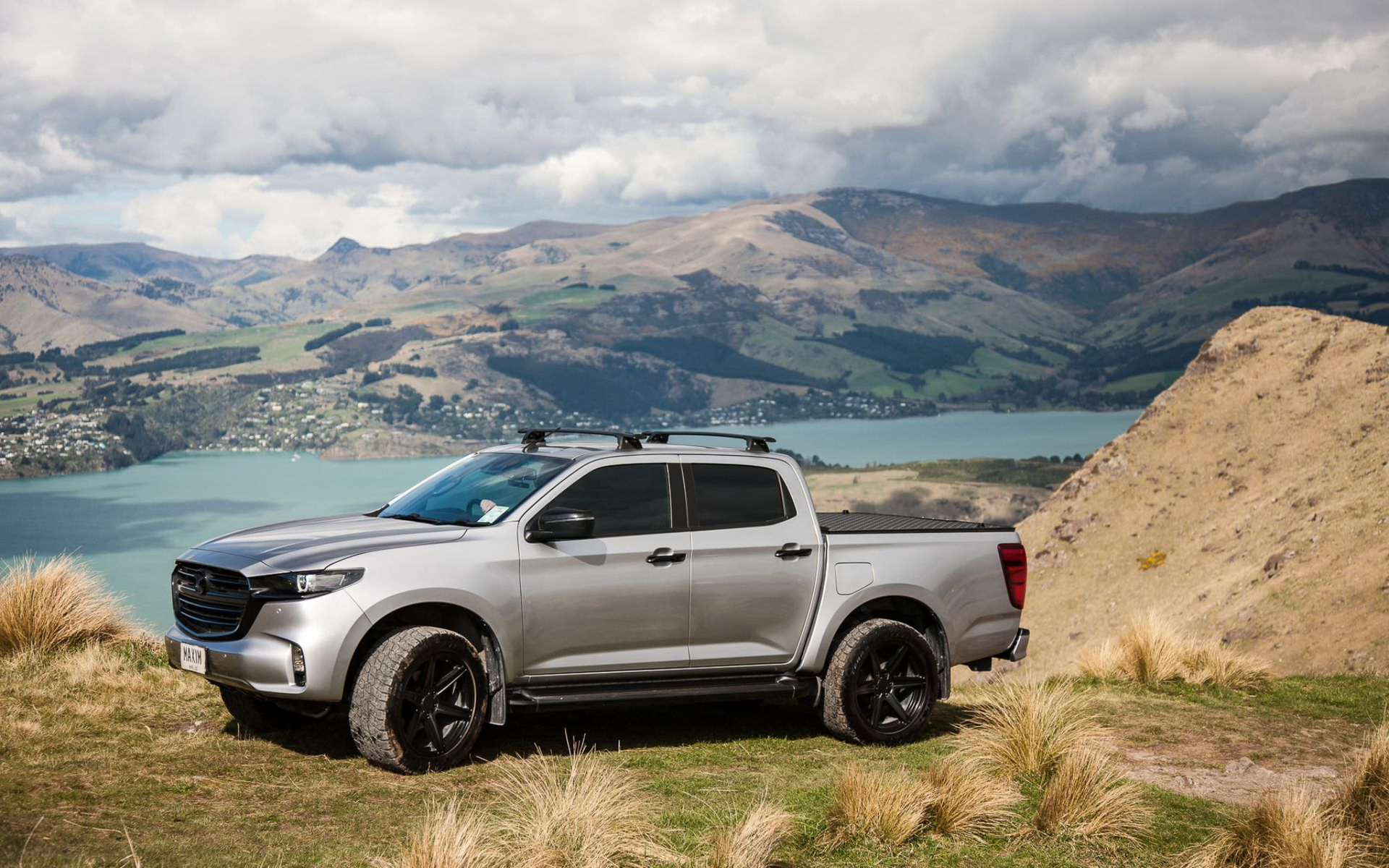 MAZDA BT-50 with MAXIM Hard Lid off road on a mountain