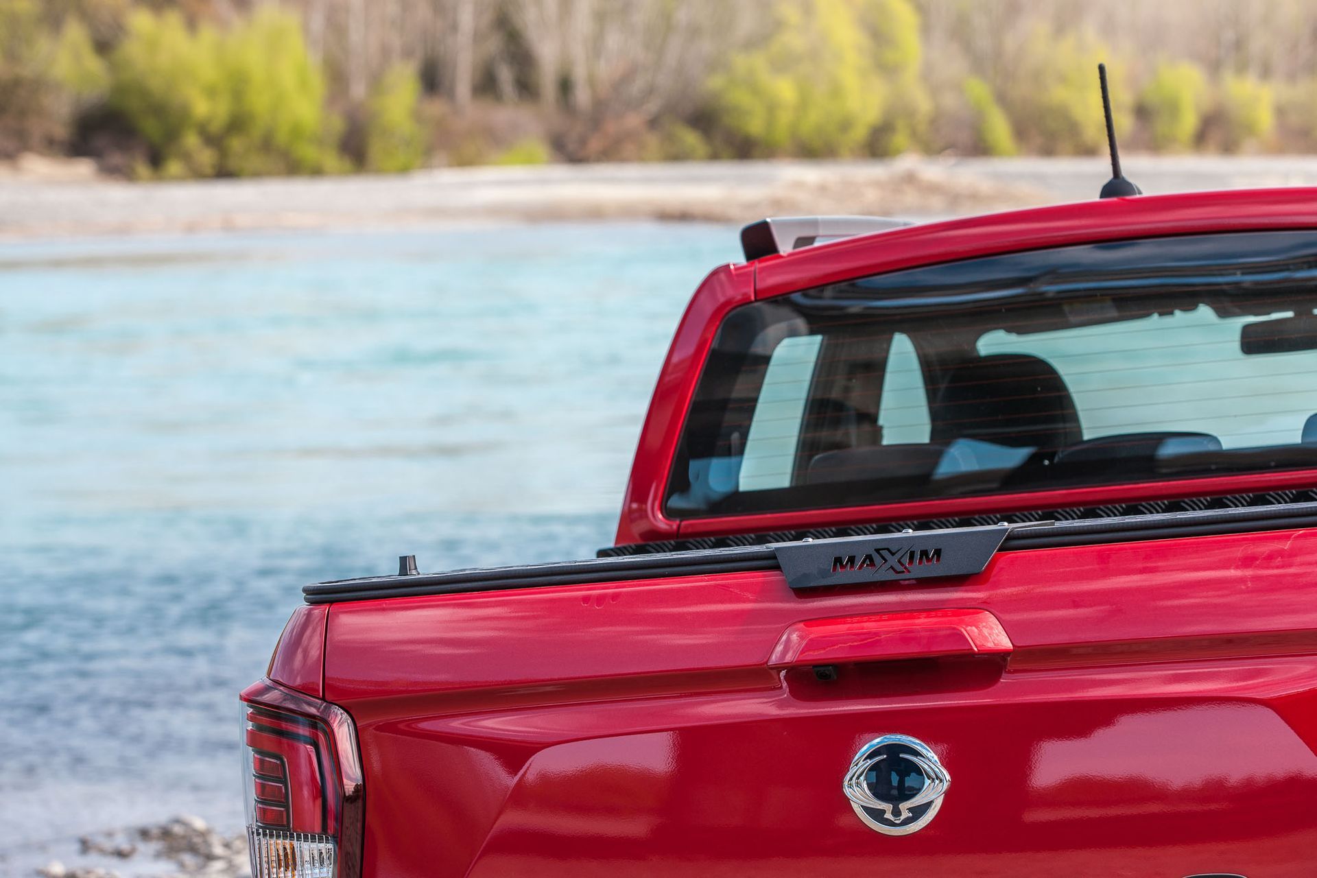 KGM Musso with MAXIM Hard Lid on riverbed.