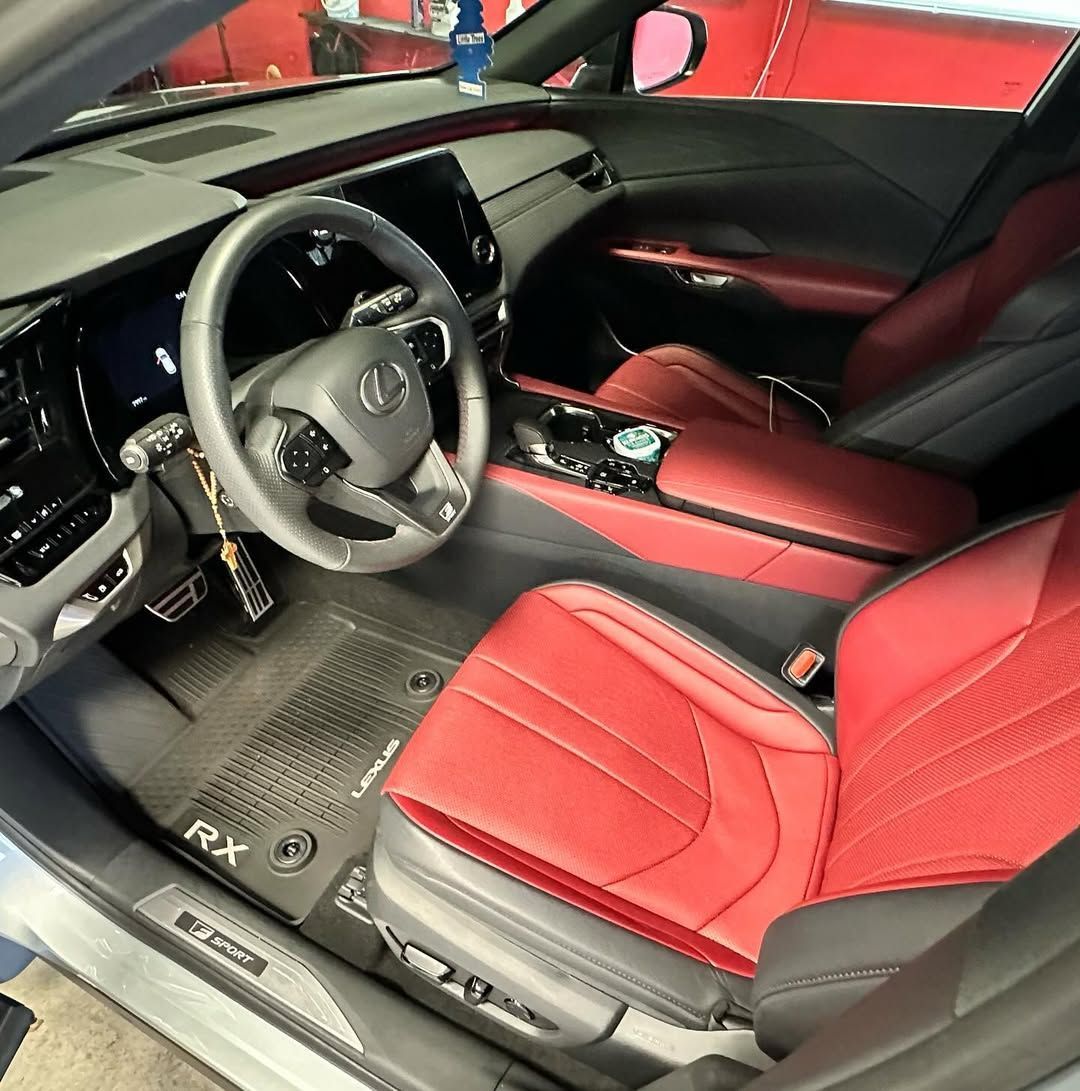 The interior of a lexus rx with red seats