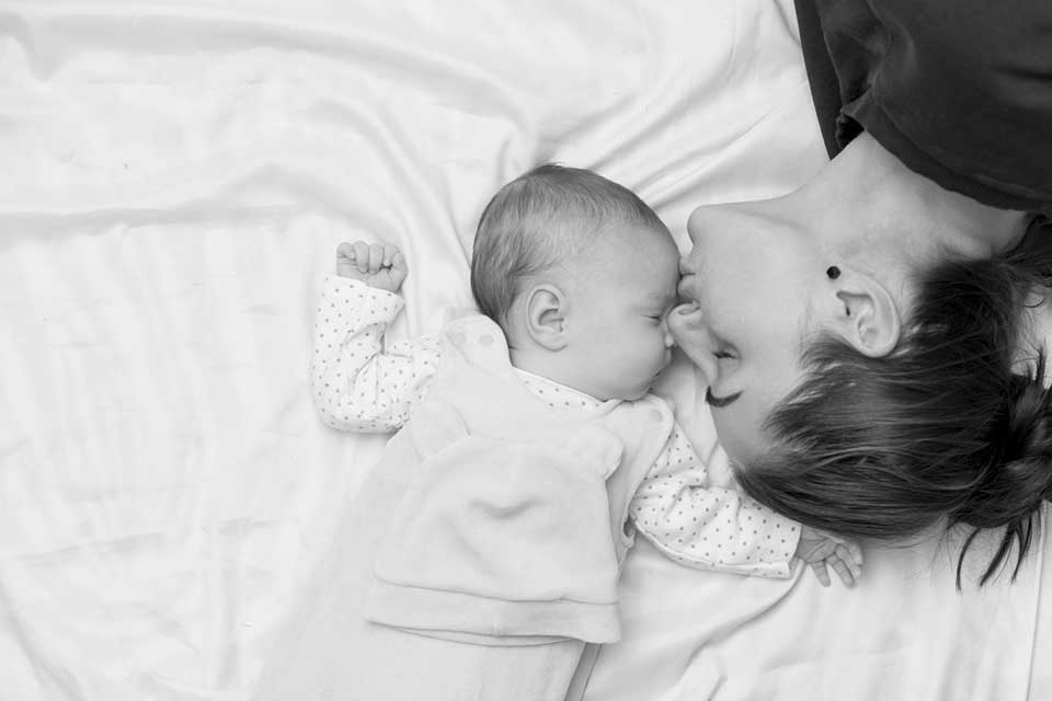 mother kissing newborn baby - Heavenly Hands Birthing Center