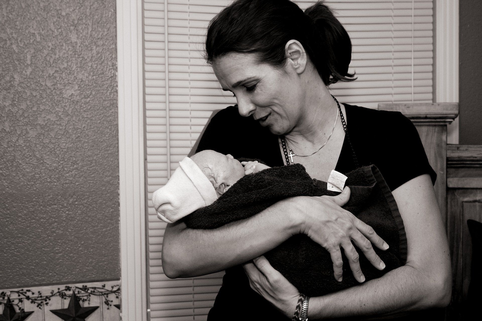 Tina from Heavenly Hands Birthing Center holding newborn baby