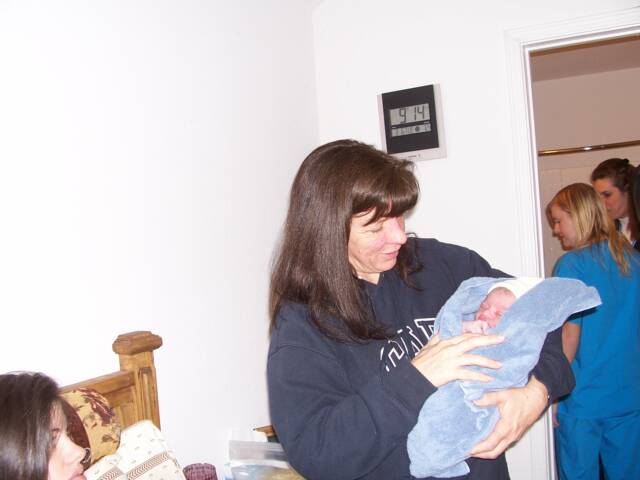 grandmother holding newborn baby - Heavenly Hands Birthing Center