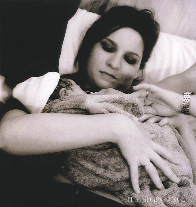 mother holding newborn baby - Heavenly Hands Birthing Center