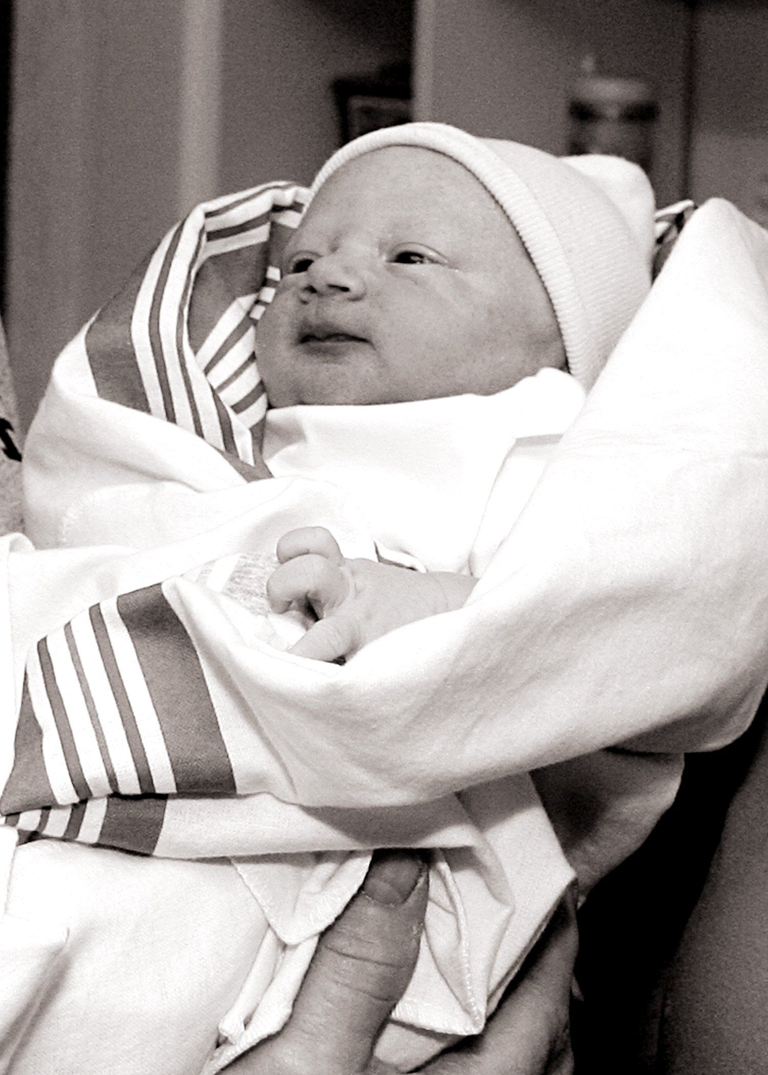 baby wrapped in receiving blanket - Heavenly Hands Birthing Center