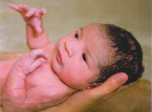 newborn baby just after water birth - Heavenly Hands Birthing Center