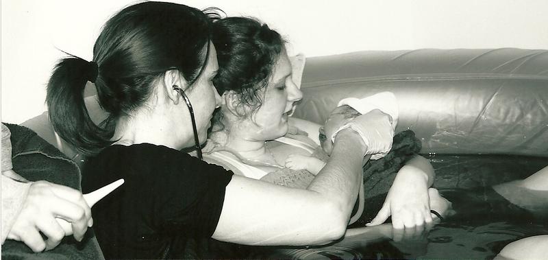 midwife checking baby's vitals just after birth - Heavenly Hands Birthing Center