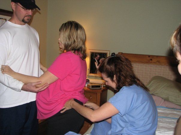 midwife massaging laboring mother's back - Heavenly Hands Birthing Center
