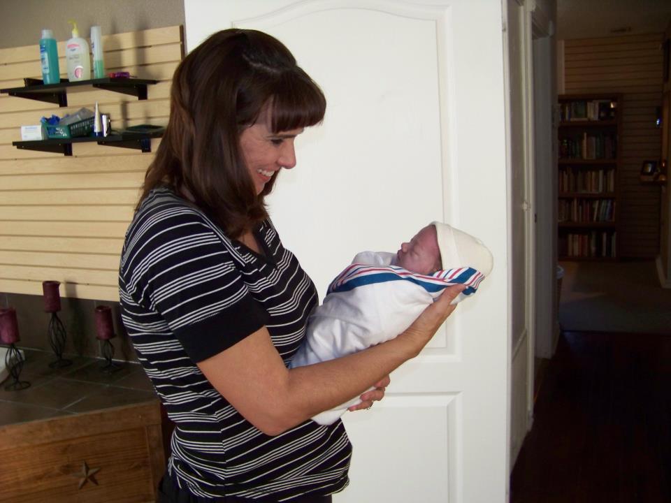 woman with baby in receiving blanket - Heavenly Hands Birthing Center
