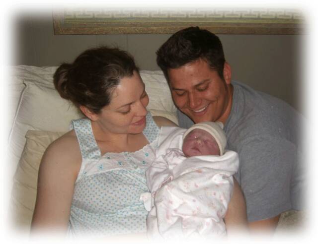 man, woman, and newborn baby - Heavenly Hands Birthing Center