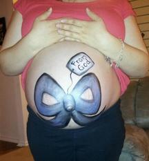 mother with painted stomach - Heavenly Hands Birthing Center