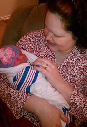 grandmother holding newborn baby - Heavenly Hands Birthing Center