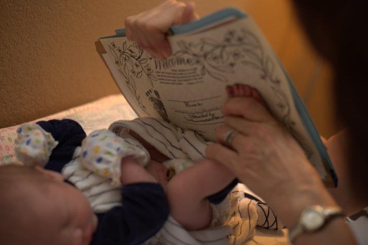 newborn baby and birth certificate - Heavenly Hands Birthing Center