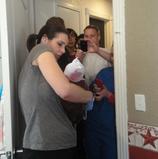 family taking pictures after baby's birth - Heavenly Hands Birthing Center