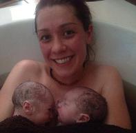 mother with twins just after water birth - Heavenly Hands Birthing Center