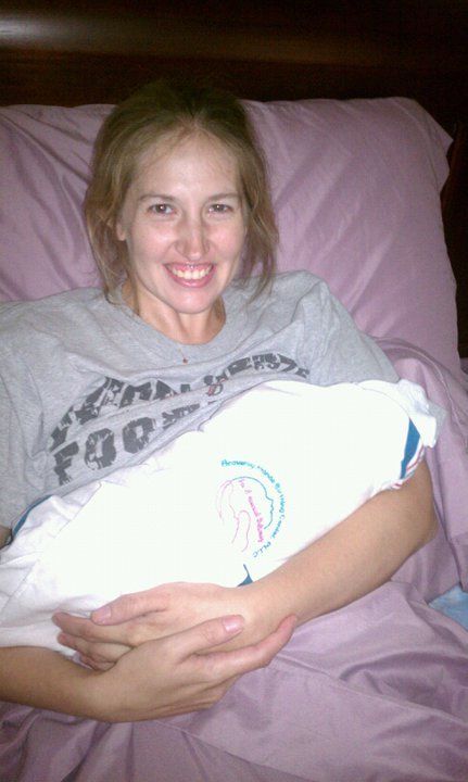mother with baby wrapped in receiving blanket - Heavenly Hands Birthing Center