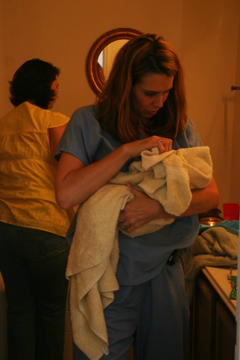 midwife with newborn baby - Heavenly Hands Birthing Center