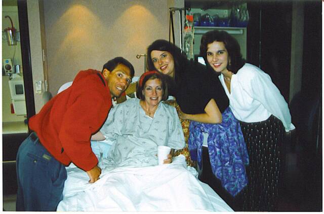 family and midwife with new mother - Heavenly Hands Birthing Center