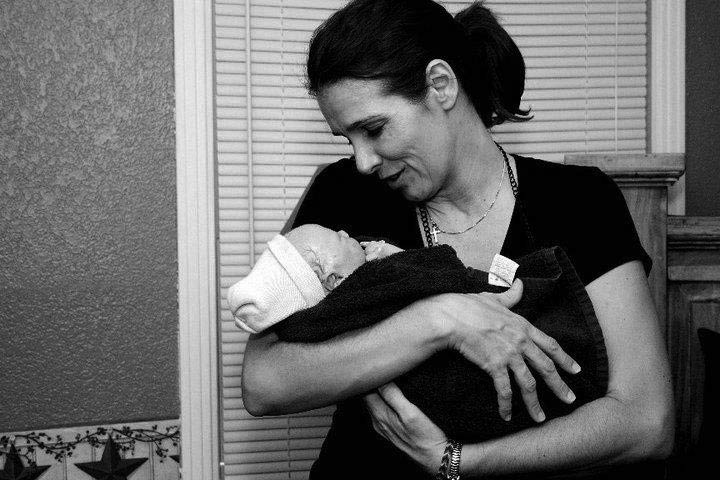 Tina from Heavenly Hands Birthing Center holding a newborn baby