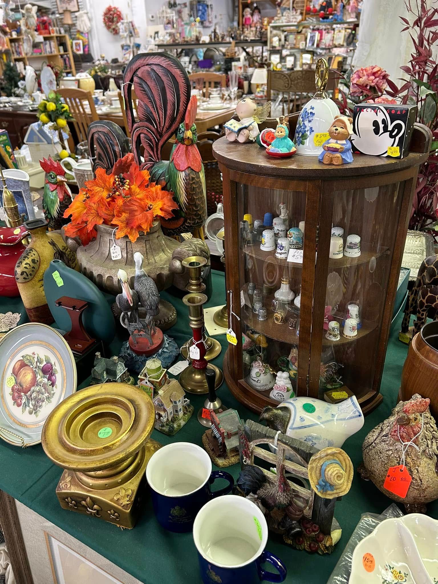 Halloween craft booth with plush pumpkins, spooky decorations, and handmade fall items on display