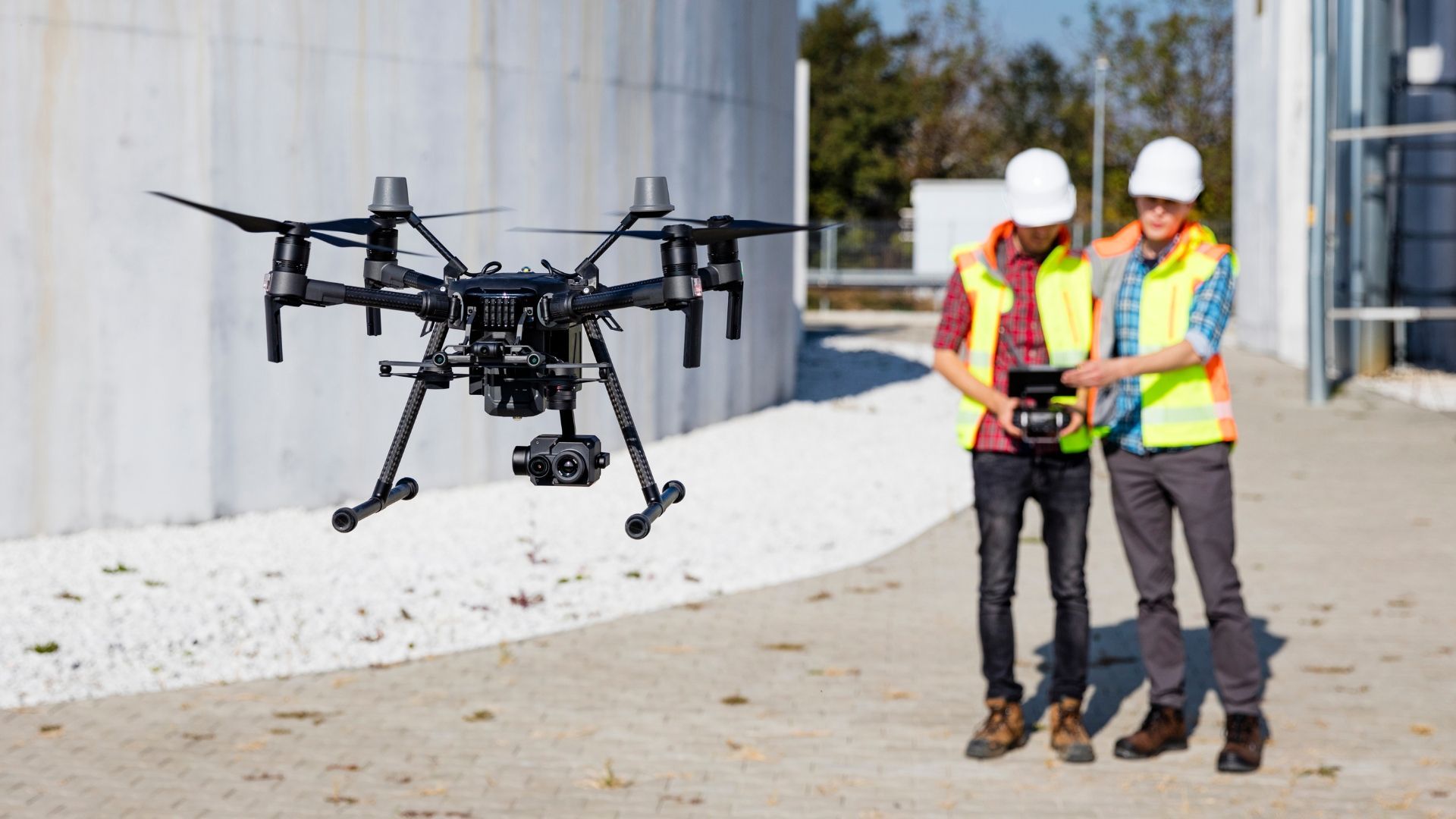 Aerial Drone Photography being controlled by two engineered in the background