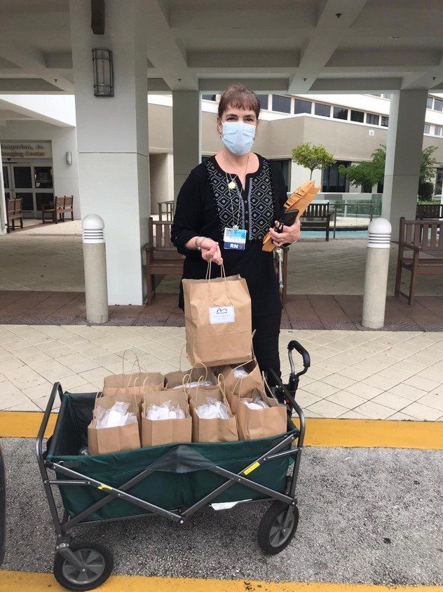 Hot woman delivering lunches to Holy Cross Hospital ICU