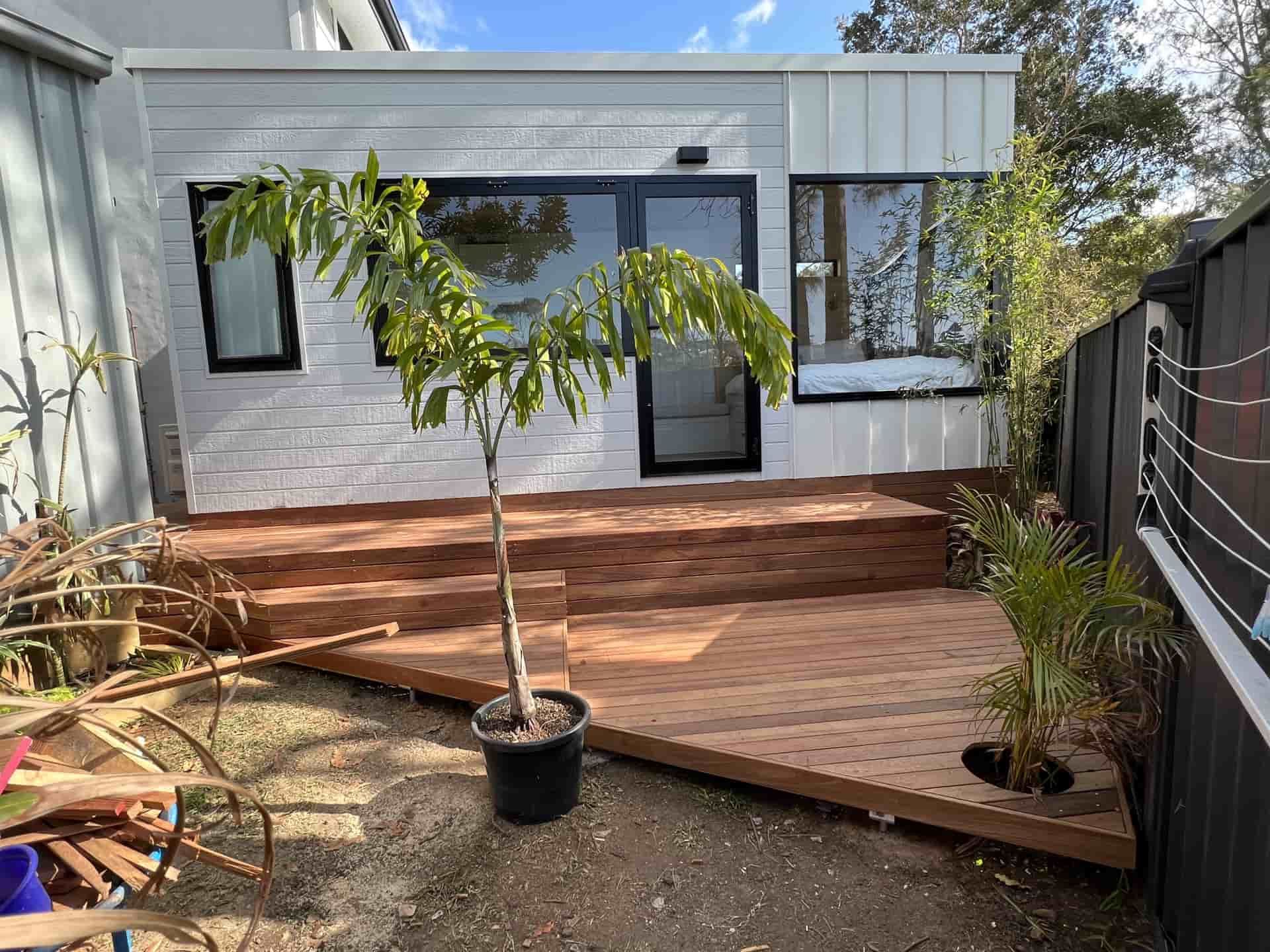 A Modern Backyard Studio With White Walls and Dark Window Frames — Taddeo Constructions in Kiama, NSW