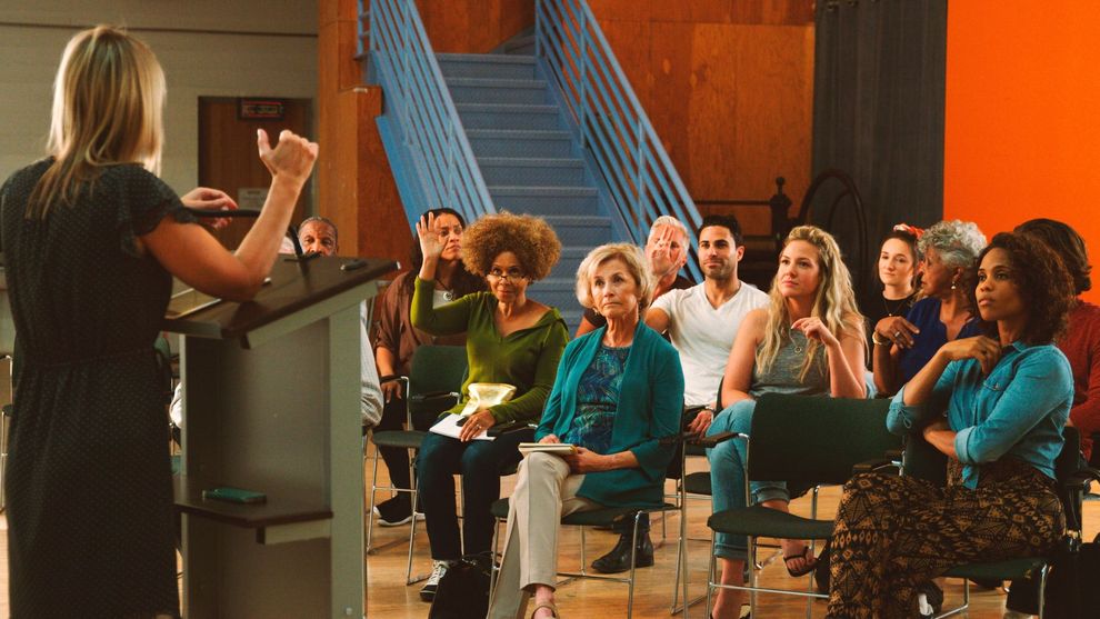 A close-up view of a deep pothole on a city street.
