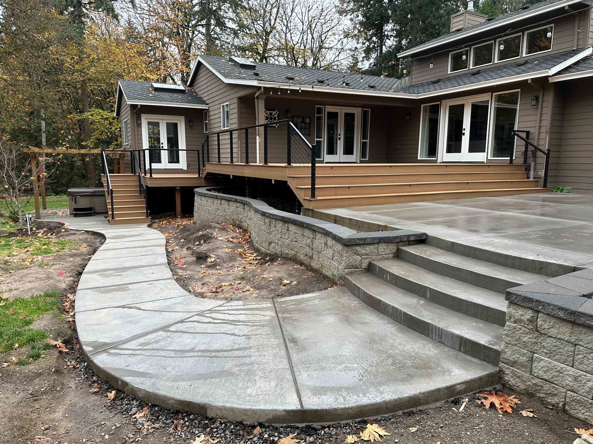 A large house with a patio and stairs in front of it in Portland OR