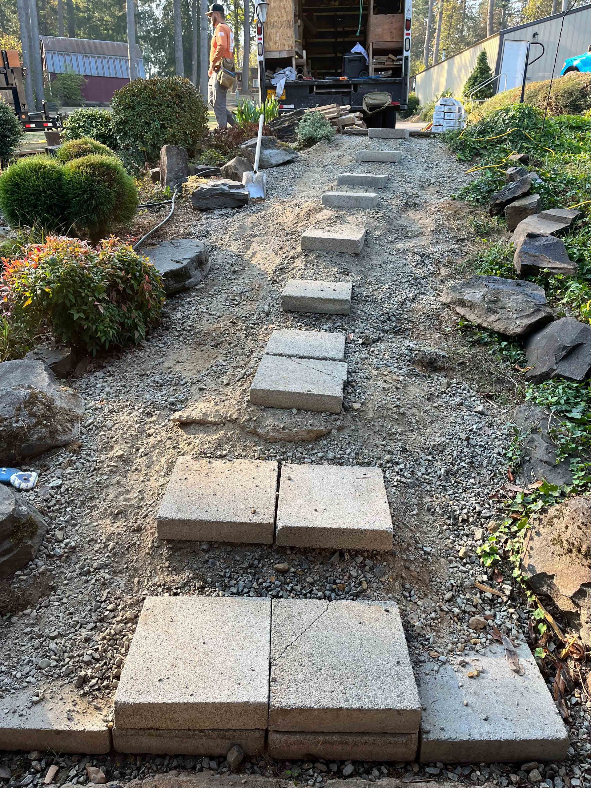 A row of stone steps leading up to a truck.