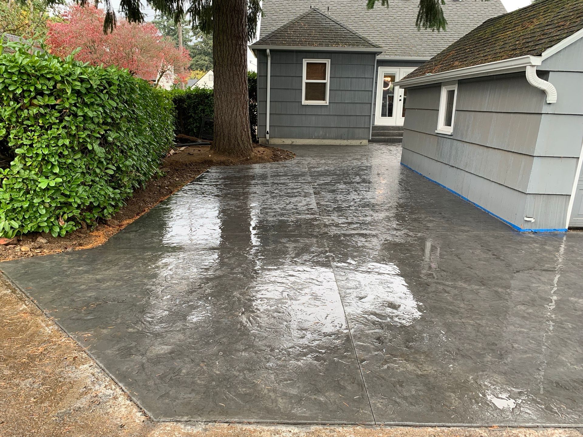 A concrete driveway in front of a house  in Portland OR