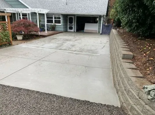 Fresh concrete driveway, leading to a garage in Clackamas OR.