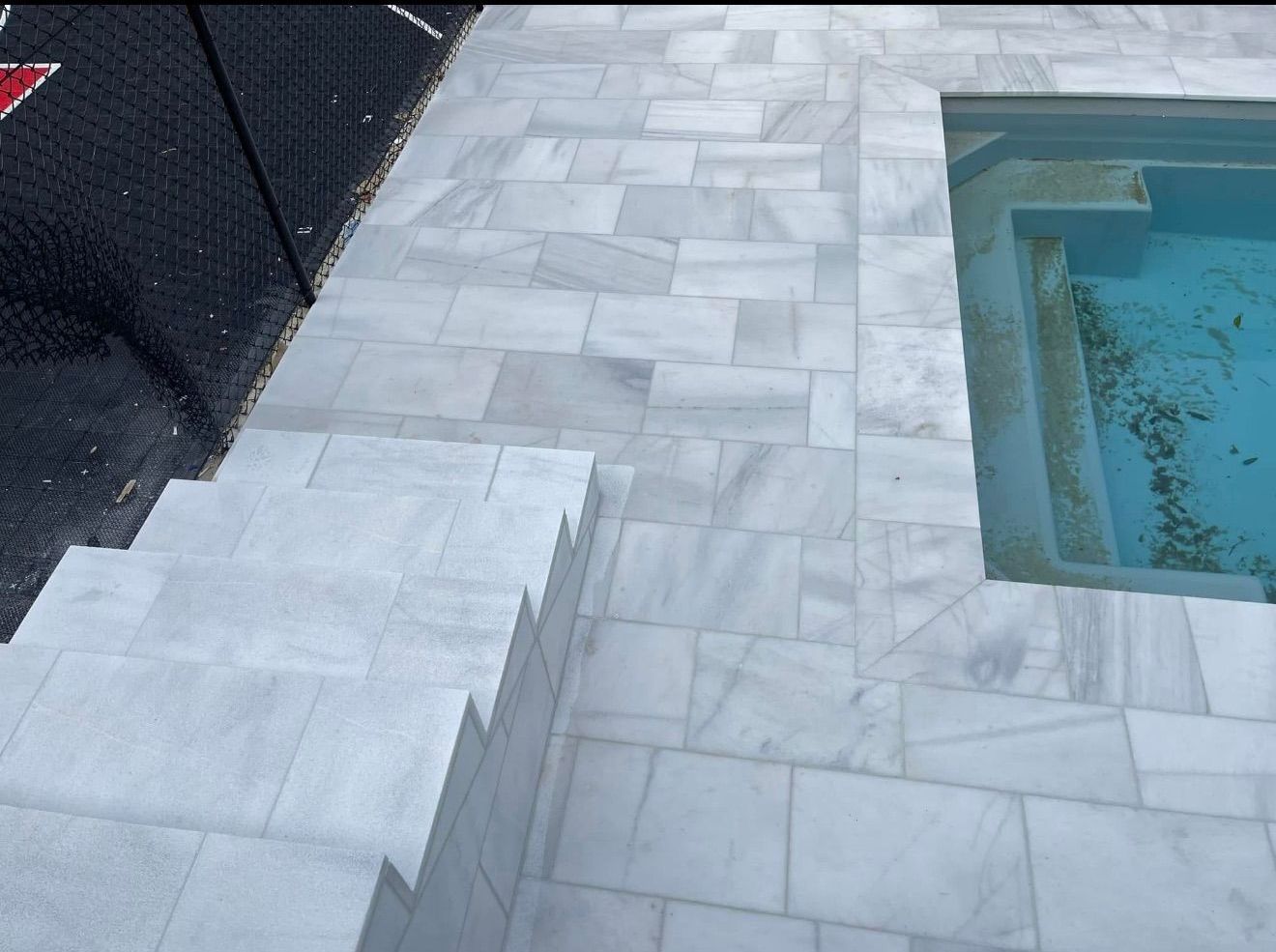 A Tile is Being Applied to a Tiled Floor With a Hole in It — Leakproof in Berkeley, NSW