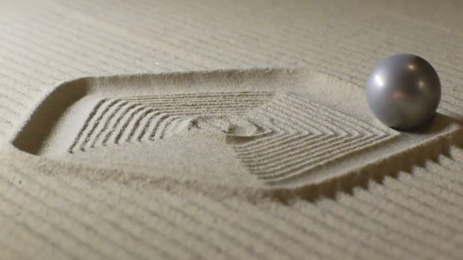 A man is hammering a piece of hardwood flooring.