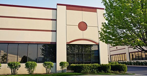 A large building with a red circle on the front of it