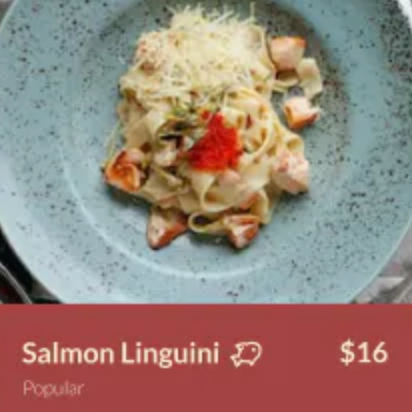 A plate of salmon linguini is being advertised for $16