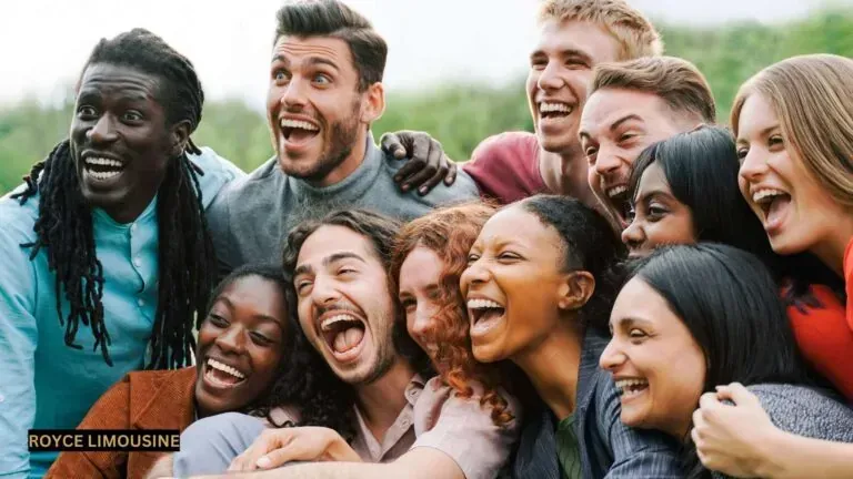 Group of diverse people smiling and laughing outdoors.