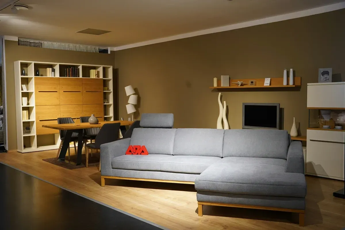 A living room with a couch and a table