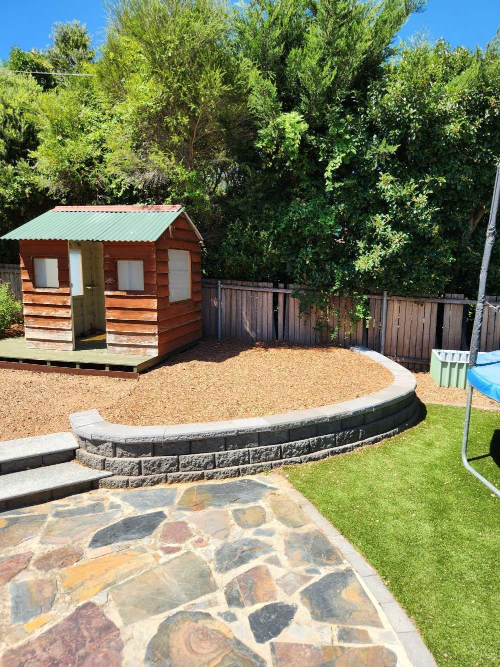 After A Backyard With A Wooden Playhouse And A Trampoline — Canberra Home and Garden Maintenance in Tuggeranong ACT