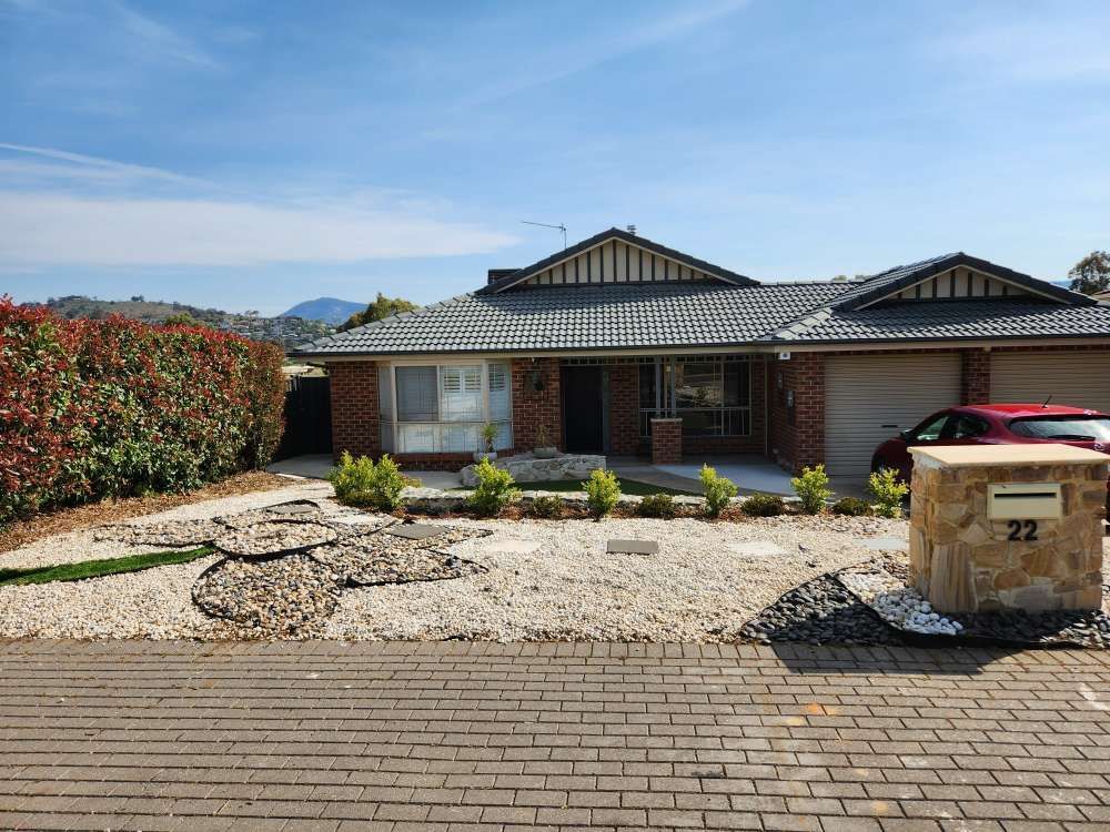 After A House With A Car Parked In Front Of It And A Mailbox With The Number 22 On It — Canberra Home and Garden Maintenance in Tuggeranong ACT