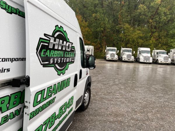 A hino carbon clean systems van is parked in a parking lot | HHO Carbon Clean Systems - North Atlanta