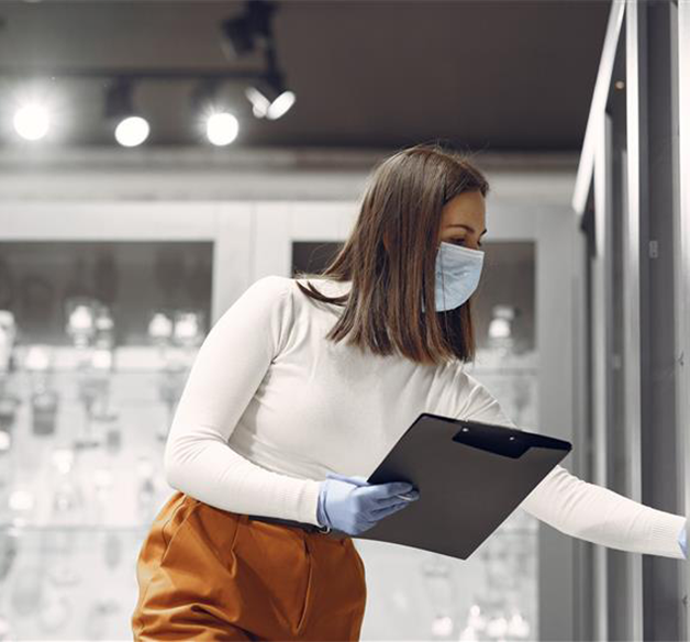 A kitchen with wooden cabinets and stainless steel appliances
