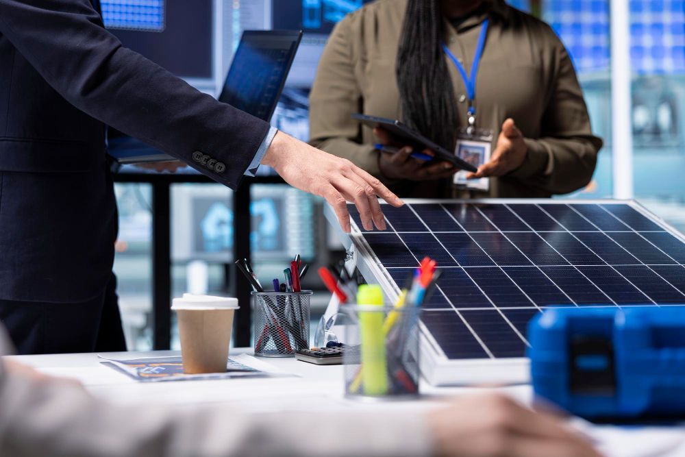 Person adjusting valves on a complex plumbing system with various pipes, gauges, and controls.