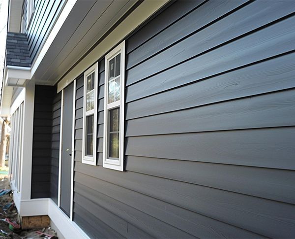 A kitchen with wooden cabinets and stainless steel appliances