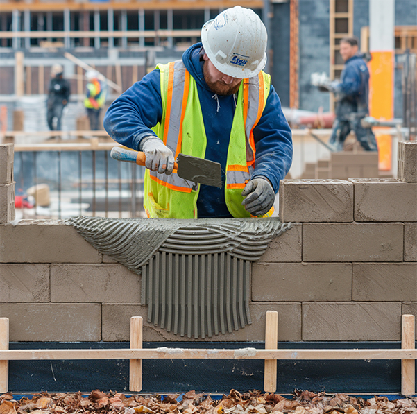 A kitchen with wooden cabinets and stainless steel appliances
