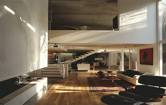 Green, rusty metal support on a concrete block wall, holding a horizontal pipe.