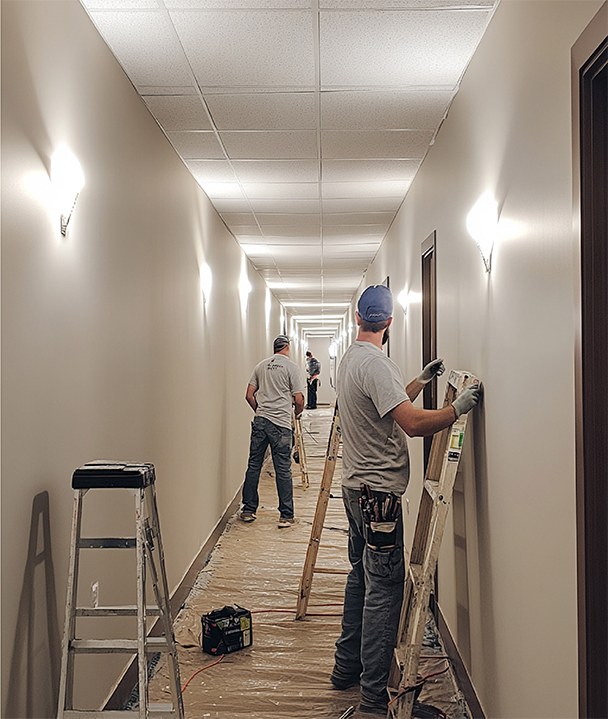 A kitchen with wooden cabinets and stainless steel appliances