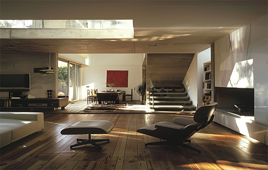 Man in white shirt opening a dryer door in a laundromat.
