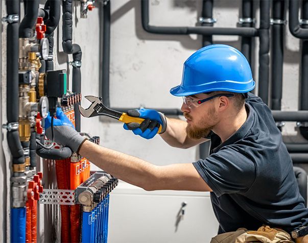 A kitchen with wooden cabinets and stainless steel appliances